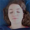 Reiki client's face with eyes closed, appears relaxed.