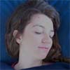 Reiki client's head has tilted to the side as her neck relaxed and she fell asleep.
